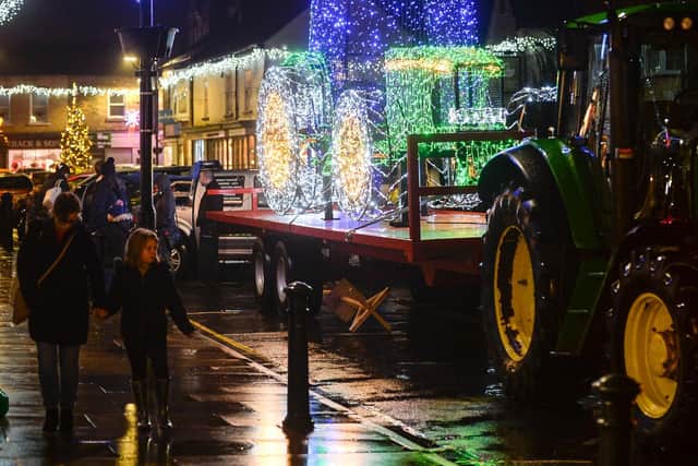 The tractor has 11,000 fairy lights and is being towed around on tour by a real tractor
