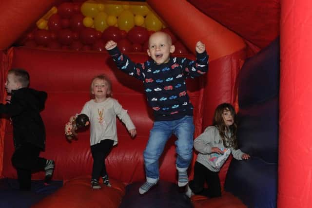 Toby's infectious smile captured the hearts of millions. Here he is enjoying his fifth birthday on a bouncy castle.
