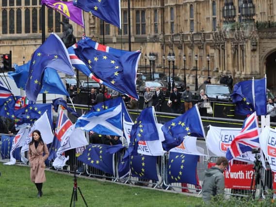Brexit supporters and pro-EU campaigners gathered outside Parliament ahead of the crunch Commons vote