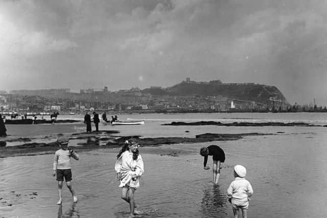 Children on the sands at Scarborough.