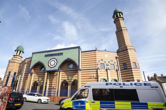 A police van parks outside Makkah Mosque in Leeds to reassure worshipers, following the Christchurch mosque attacks in New Zealand.