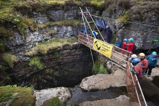The winch, operated by Bradford Caving Club, is positioned above the entrance to the pothole