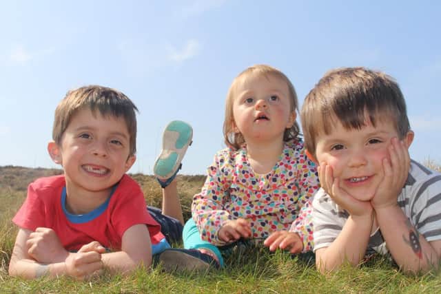 Sam Tuckett with his brother Oscar, 4, and sister Ella, 1.