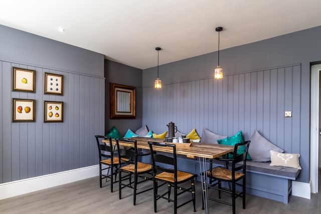 The dining area in the kitchen with table that can seat 10 people