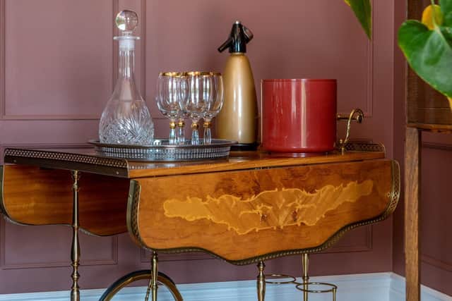 This vintage drinks trolley adds an elegant touch to the sitting room