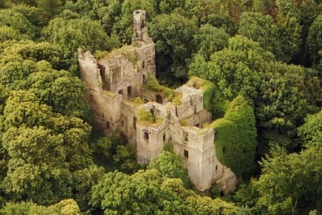 The castle is hidden deep within woodland