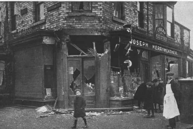 Damage to the Merryweathers' shop. Emily Merryweather was killed while trying to usher people to safety in their cellar