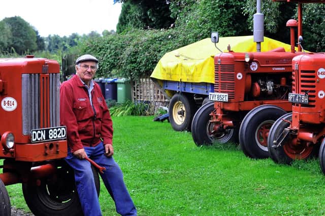 David Robinson amongst some of his vintage tractors that he will be taking to the Hunton Steam Gathering. Picture by Gary Longbottom.