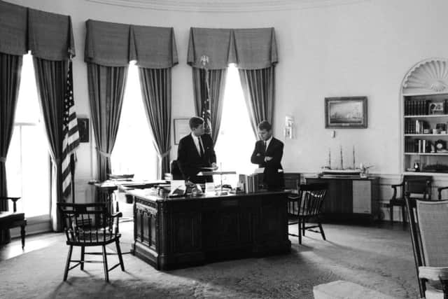President John F. Kennedy in the Oval Office with his brother, Attorney General Robert F. Kennedy.  (Photo by Art Rickerby/The LIFE Picture Collection/Getty Images)