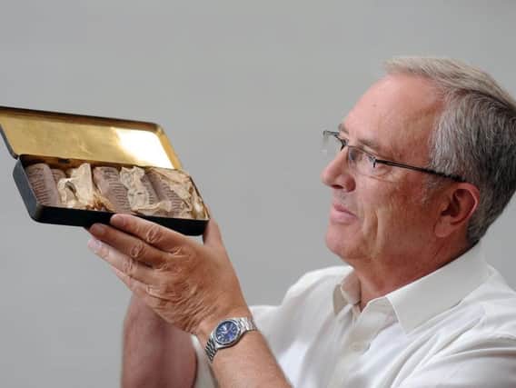 Charles Moses - director of auctioneers CJM - together with nine 103-year-old chocolate bars discovered among the mementos of WW1 hero Richard Bullimore.