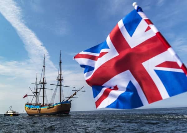 HM Bark Endeavour, a full-scale replica of Captain Cook's ship, is pulled by a tugboat from Middlesbrough to its permanent home in Whitby. Danny Lawson/PA Wire