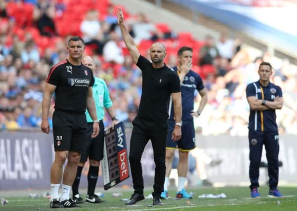 Rotherham United manager Paul Warne, right, with assistant Richie Barker, left, during the recent League One Play-off Final at Wembley. Picture: John Walton/PA