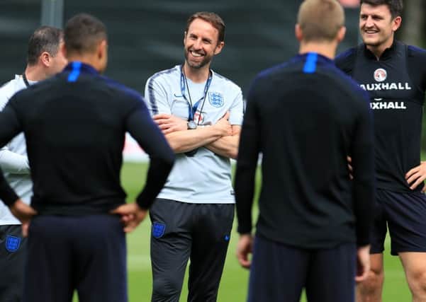 England manager Gareth Southgate shares a joke with players and staff during a training session at The Grove Hotel, London on Friday (Picture: Mike Egerton/PA Wire).