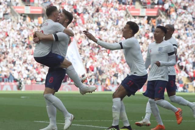 England's Gary Cahill (second left) celebrates scoring his side's first goal of the game with Kieran Trippier. Picture: Nick Potts/PA