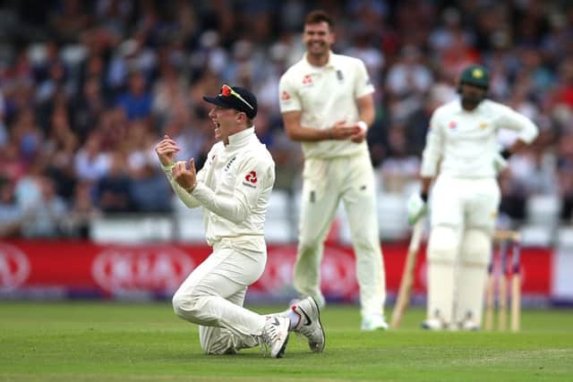 England's Dom Bess celebrates after taking the catch of Pakistan's Haris Sohail on day three at Headingley. Picture: Nigel French/PA