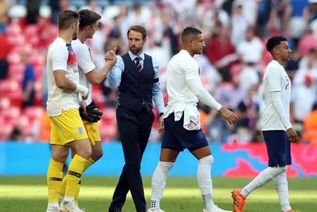England manager Gareth Southgate (third left) shakes hands with goalkeeper Tom Heaton after the final whistle at Wembley on Saturday. Picture: Nick Potts/PA