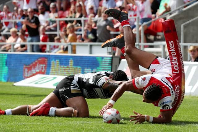 FOR STARTERS: Regan Grace of St Helens scores his side's second try. Picture by Paul Currie/SWpix.com