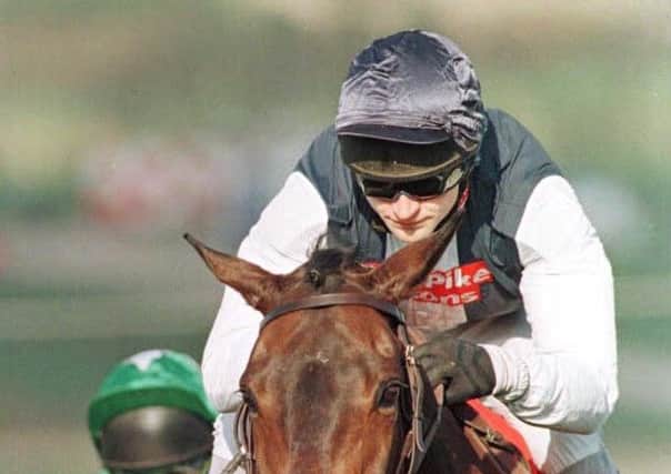 Andrew Thornton and Cool Dawn clear the last fence in the 1998 Gold Cup.