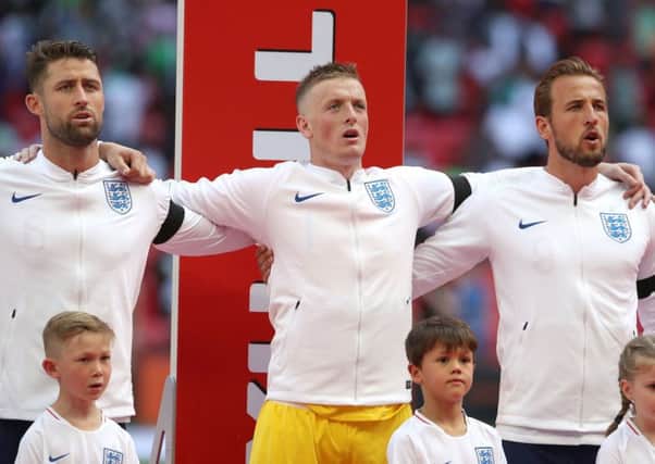 ON SONG (left to right): Gary Cahill, Jordan Pickford and Harry Kane sing the national anthem before the clash with Nigeria at Wembley on Saturday. Picture: Nick Potts/PA