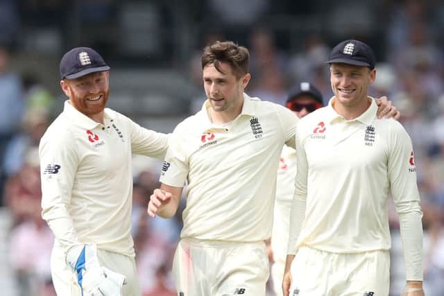 RULED OUT: England's Chris Woakes (centre) celebrates taking the wicket of Pakistan's Hasan Ali on day one at Headingley. Picture: Martin Rickett/PA