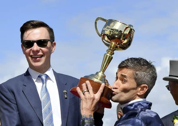 Trainer Joseph O'Brie celebrates after Rekindling wins the Melbourne Cup at Flemington in November 2017. Picture: AP/Andy Brownbill.