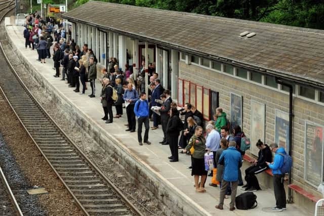 Passengers waiting for a train at Horsforth Station.