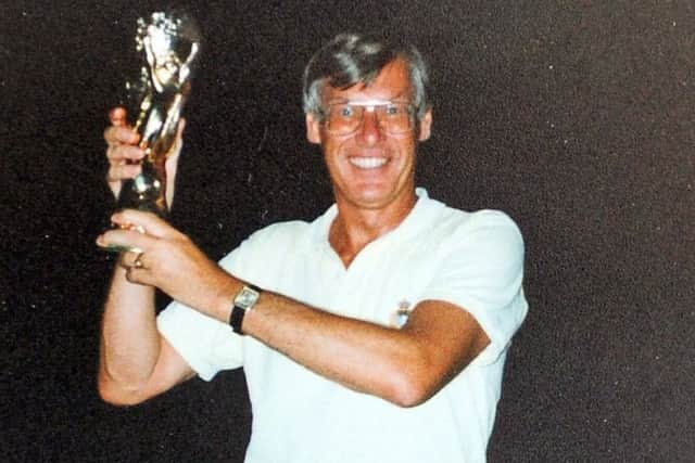 It's mine: 
Commentator John Helm with the World Cup.