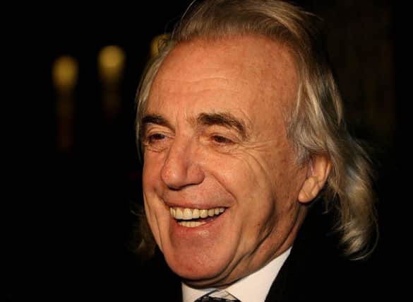 File photo showing nightclub owner Peter Stringfellow celebrating after he was granted a licence for his proposed club to be based in central Dublin. Stringfellow had died aged 77, a spokesman said. Photo: PA Wire