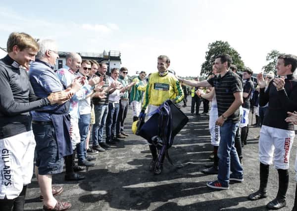 Honour guard:  Andrew Thornton after his last ride as a jockey as he retires at Uttoxeter. Picture: Alan Crowhurst/Getty Images