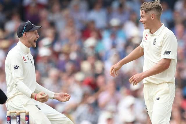 BARGAIN: England's Joe Root and Sam Curran celebrate taking the wicket of Pakistan's Shadab Khan during the recent Test Match at Headingley. Picture: Martin Rickett/PA.