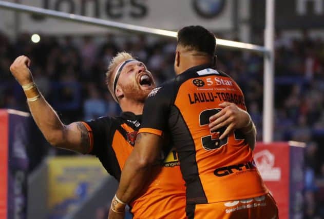 Oliver Holmes of Castleford Tigers celebrates scoring the fifth try with QLT (Picture: Paul Currie/SWPix.com)