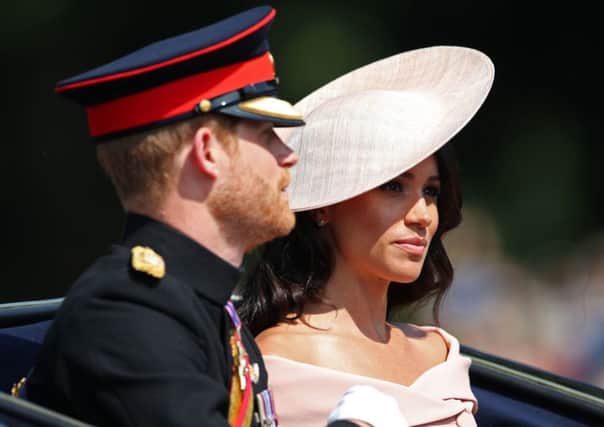 The Duke and Duchess of Sussex arrive at Horse Guards Parade, central London, during the Trooping the Colour ceremony, as the Queen celebrates her official birthday. PIC: PA