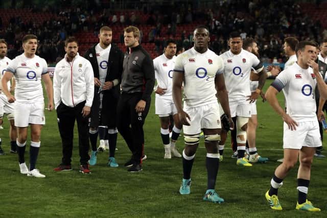 England's captain Owen Farrell, far left,  stands dejected with his team-mates after defeat in the first Test to South Africa at Ellis Park. Picture: AP/Themba Hadebe