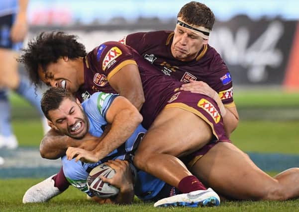 INTENSE: New South Wales' James Tedesco is tackled by Queensland's Felipe Kaufusi during game one of the State Of Origin series at the MCG, Melbourne last week. Picture: Quinn Rooney/Getty Images)