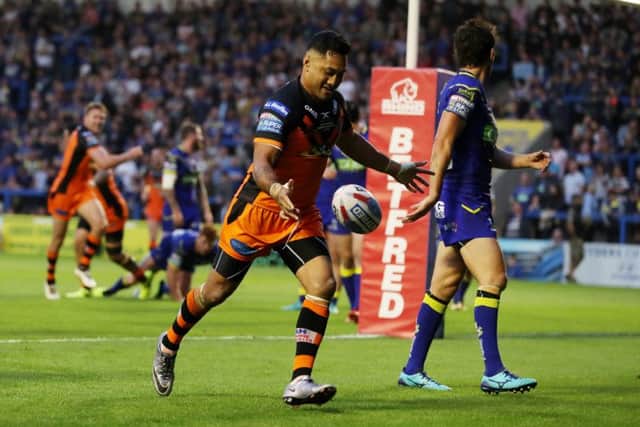 Quentin Laulu-Togaga'e of Castleford Tigers celebrates scoring at the his side's fourth try against Warrington. Picture by Paul Currie/SWpix.com
