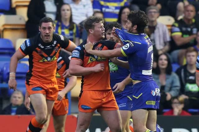FLASHPOINT: Castleford Tigers' Adam Milner clashes with Warrington's Stefan Ratchford on Friday night. Picture:  Paul Currie/SWpix.com
