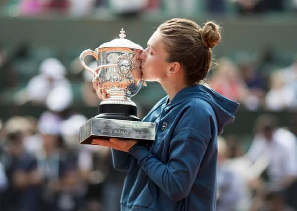 TOP OF THE WORLD: Simona Halep with the trophy after her French Open women's singles final victory against Sloane Stephens. Picture: Tim Clayton/Corbis/Getty Images)