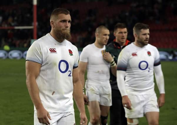 England's Brad Shields, left, shows his disappointment after defeat at Ellis Park. AP/Themba Hadebe