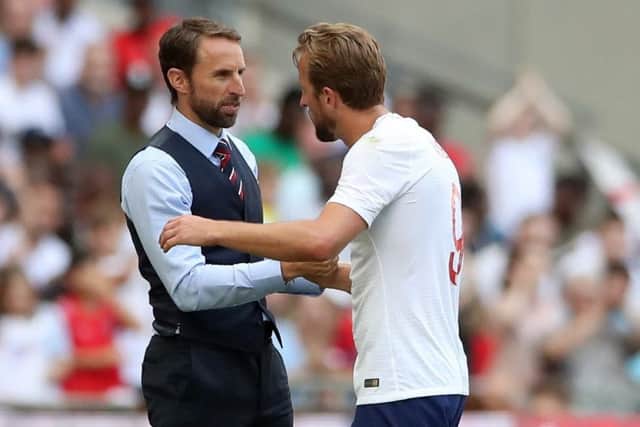 England's Harry Kane chats with manager Gareth Southgate on the touchline at Wembley in the recent friendly against Nigeria. Picture: Nick Potts/PA.