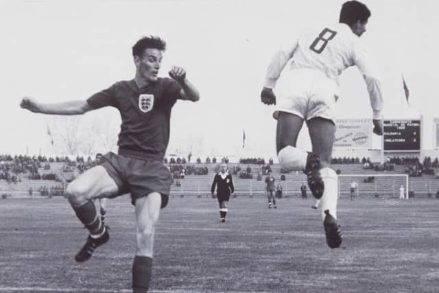 England's Alan Peacock and Bulgaria's Velitchkov  (Photo by Popperfoto/Getty Images)
