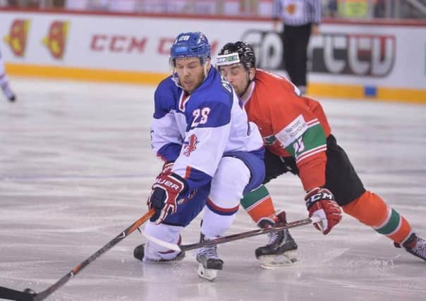 TRUE GRIT: GB's Ben O'Connor battles for puck possession against Hungary on Saturday night. Picture: Dean Woolley.