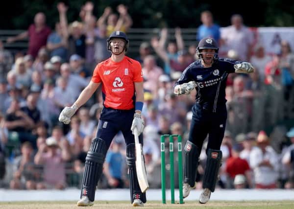 England's Sam Billings reacts after being caught.