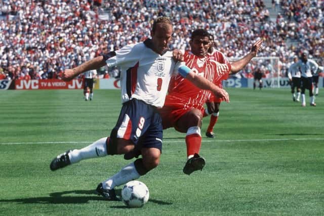 LEADING THE LINE: Alan Shearer battles with Tunisia's Khaled Badra at marseille in 1998. Picture: Alexander Hassenstein/Bongarts/Getty Images