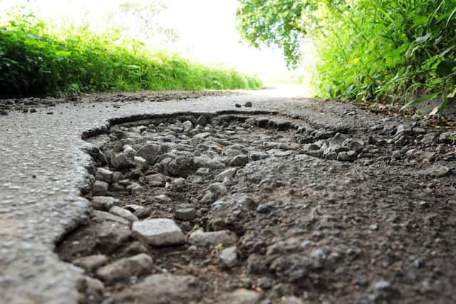 What can be done to speed up the repair of potholes?