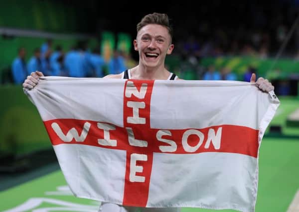 England's Nile Wilson celebrates winning a gold medal in the Men's Individual All-Around Final at the Gold Coast Commonwealth Games. Picture: Mike Egerton/PA.