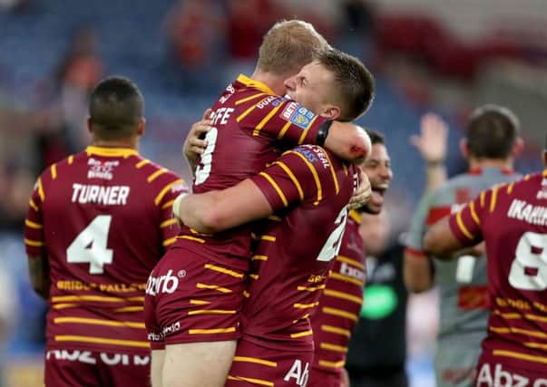 Huddersfield Giants pair Alex Mellor and Ryan Hinchcliffe celebrate victory..