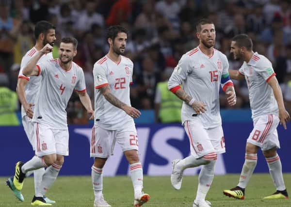 CLASSY START: Spain's Nacho, left celebrates with team-mates after scoring his sides third goal during the group B match against Portugal. Picture: AP/Manu Fernandez)