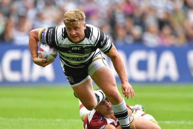 Hull FC's Jack Downs is tackled by Wigan Warriors' Ben Flower at the KCOM Stadium. Picture: Dave Howarth/PA