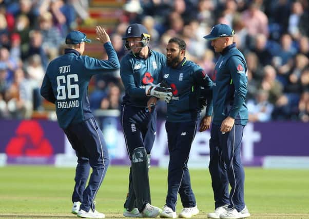 England's Adil Rashid (centre) celebrates with Joe Root (left) Jos Buttler (second left) and Jason Roy (right) after taking the wicket of Australia's Aaron Finch. Picture: Nigel French/PA