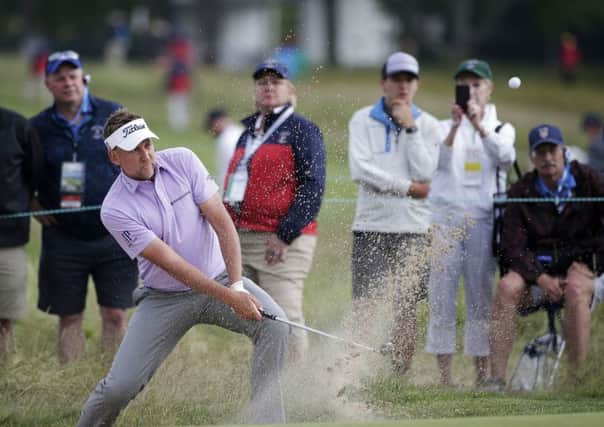 Ian Poulter plays a shot from a bunker during the US Open at Shinnecock Hills (Picture: Seth Wenig/AP).